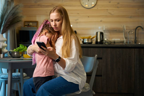 istock Worried mother hugging her little crying daughter 1752542821