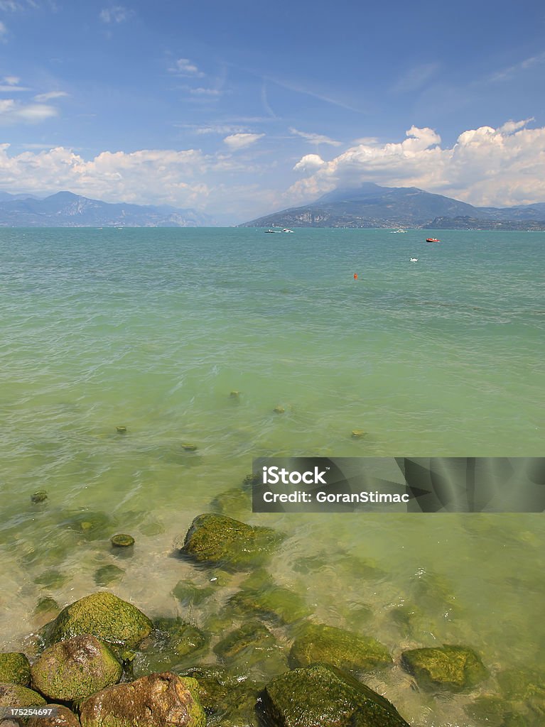 Turquoise Garda lake View of a beautiful Garda lake in summer time, Italy. Backgrounds Stock Photo