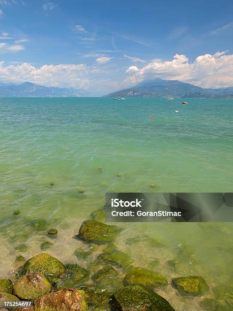 Turquoise Garda Lake Stock Photo - Download Image Now - Backgrounds, Blue, Cloud - Sky