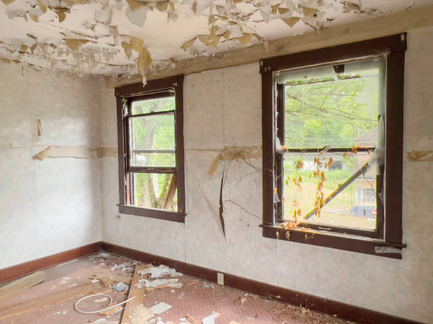 istock broken windows of an abandoned house with pealed ceiling 1752548082