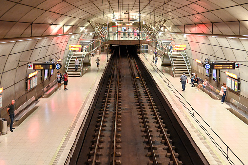 Getxo, Spain, October 17, 2023 - A platform of Sarriko metro station with a train of the UT500 series of Bilbao metro.