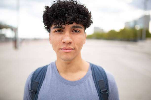 istock Close up handsome young man with curly hair 1752553569