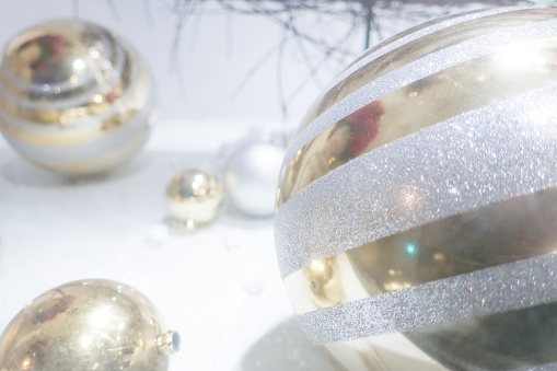 Christmas decor: silver glass balls, on white snow