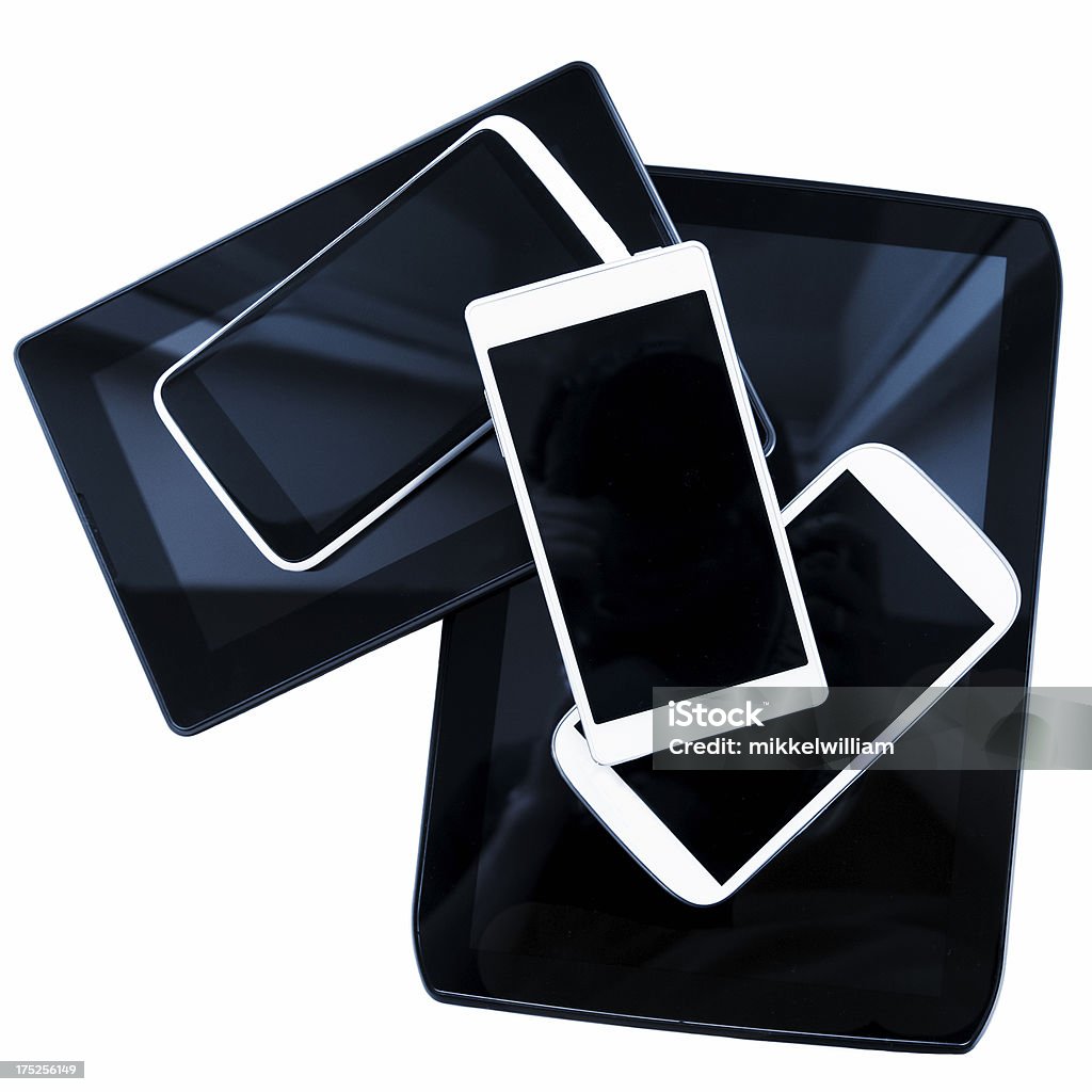 Nuovi telefoni cellulari e i tablet digitale in pile - Foto stock royalty-free di Grande gruppo di oggetti