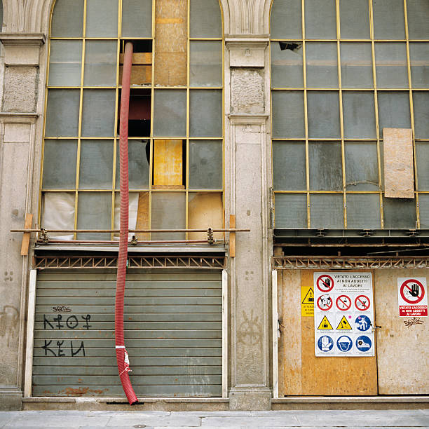 istock One long pipe comes down from a building being renovated 175256329