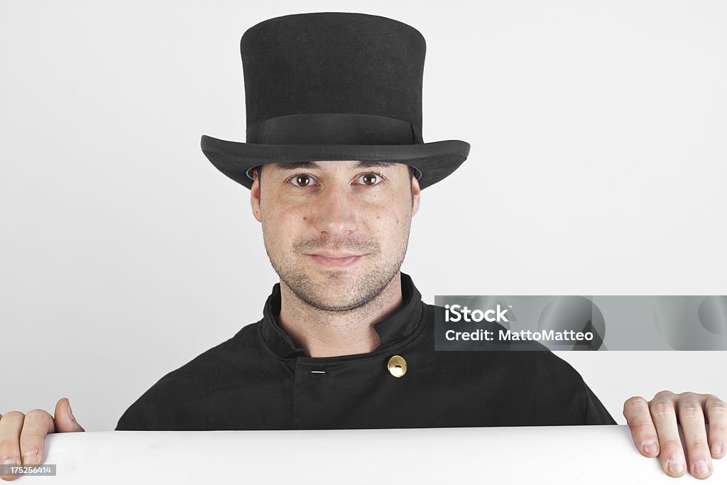 Young chimney sweep A young chimney sweep in front of a grey background Adult Stock Photo