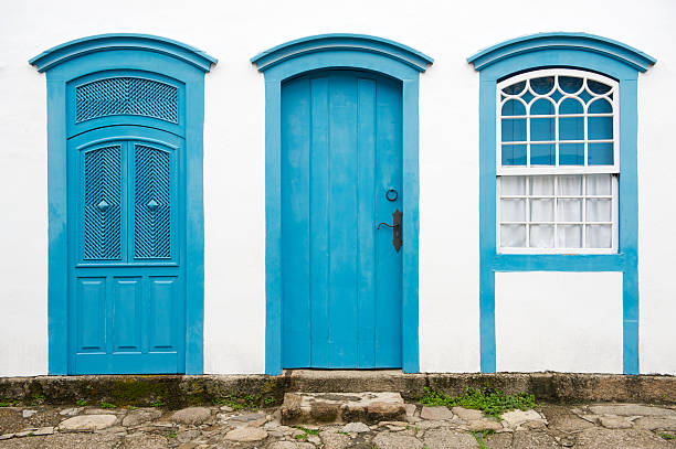 istock Blue Door with Matching Windows and Shutters White Wall 175256558
