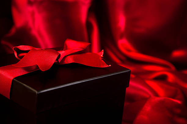 istock Valentine's Day gift in black box on red satin 175256677