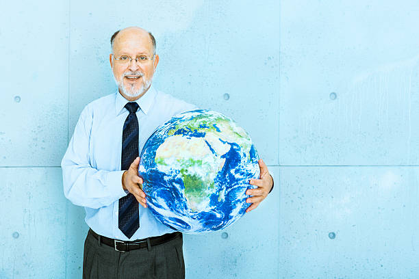 istock Senior businessman holding world globe 175256767
