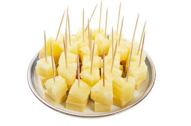 Plate Of Cheese And Pineapple On Cocktails Sticks A plate of cheese and pineapple on sticks.More images of food and cooking cocktail stick stock pictures, royalty-free photos & images