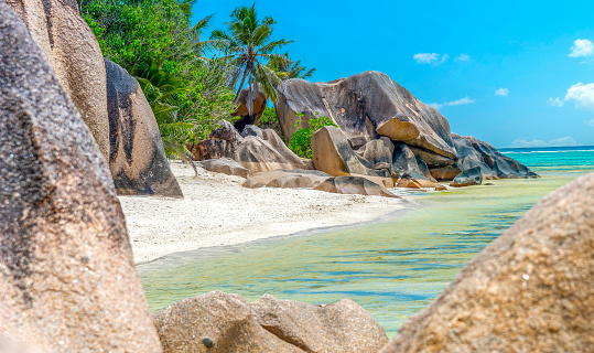 Small cove surrounded by granite rocks in Anse Source d'Argent. La Digue island, Seychelles