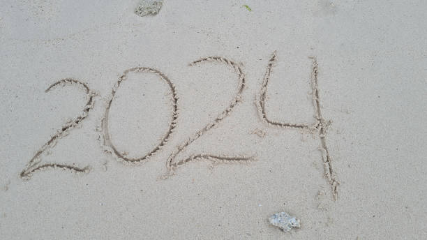 istock 2024 hand written in sand on a beautiful beach 1752571520