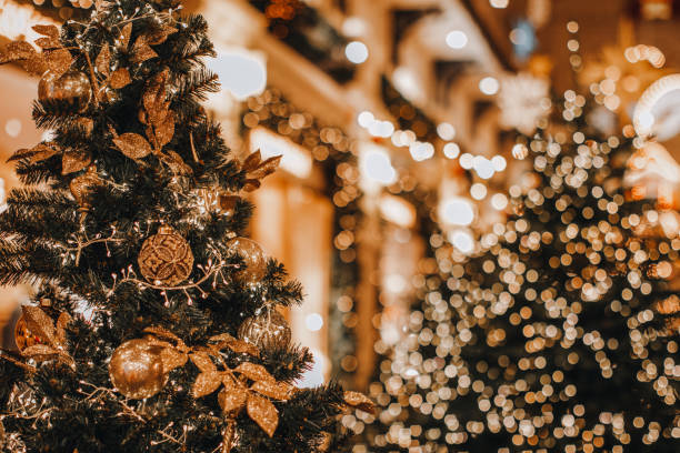 istock Shining, magical Christmas trees decorated with golden garlands 1752573288