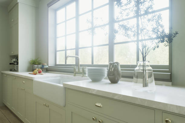 istock Kitchen in traditional style. Kitchen sink near a large window, many convenient cabinets with kitchen utensils. 3D rendering. 1752575706