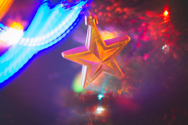 Christmas decorations and ornaments with golden glitter on abstract background. Holidays celebration and party. Season greetings and wishes.