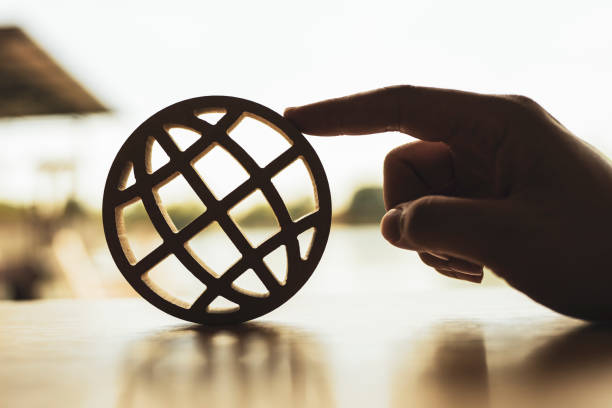 Wooden Globe icon. Concepts about nature and conservation and taking care of the world. stock photo