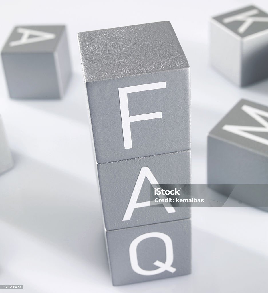 FAQ (Frequently Asked Questions) Businessman forming words from alphabet blocks. Advice Stock Photo