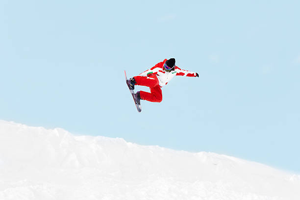 Snowboarder freestyle stunt on the mountain slope