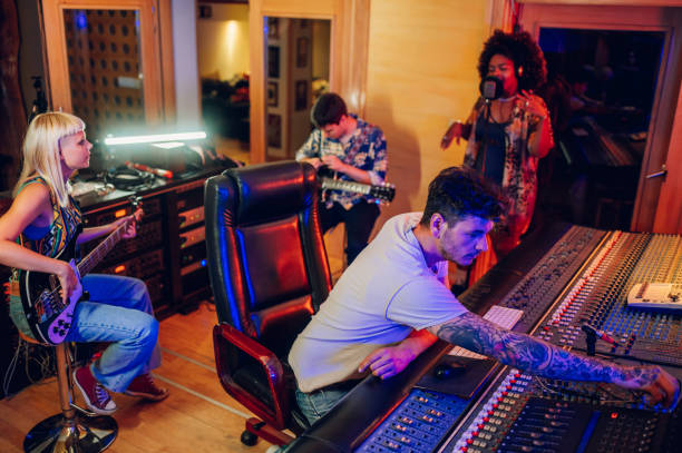 istock Recording session in a music studio with band and audio production technician 1752586044