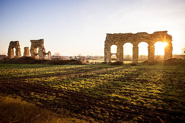 The Roman Aqueduct at Parco degli Acquedotti "Ancient roman aqueduct, ruins of the old water pipe built by the Romans." ancient rome stock pictures, royalty-free photos & images