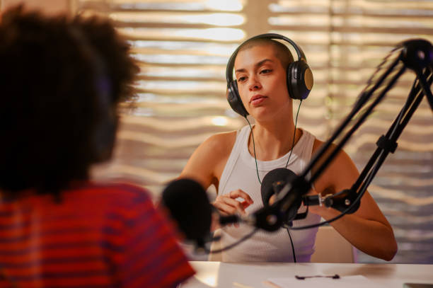 istock A serious podcast guest is sitting with a host in a small recording studio 1752586316