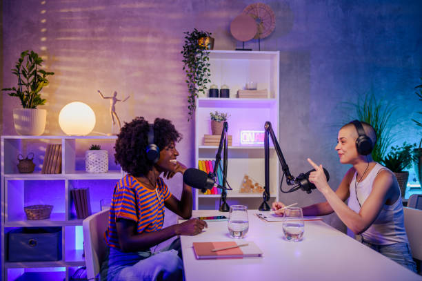 istock Two multicultural girls are sitting in a broadcasting studio and making a podcast. 1752586341
