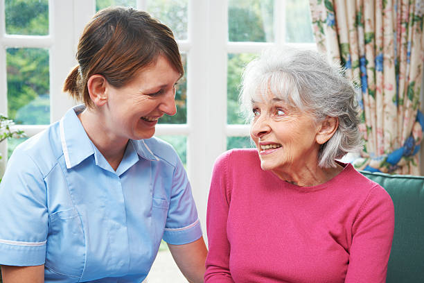 istock Senior Woman Chatting With Carer 175259301