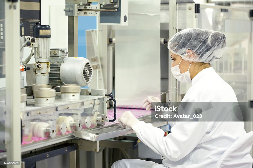 Woman working at the pharmaceutical factory Woman working at the pharmaceutical  factory. See more images and video from this series. Pharmacy Stock Photo