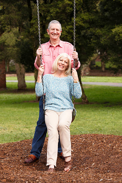 istock Smiling senior couple enjoying leisure in park 175259703