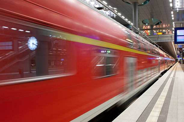 istock High speed commuter train passing by in a railway station 175260126