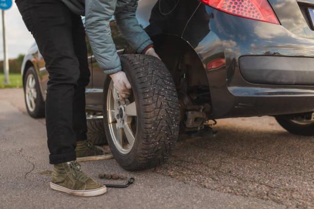 istock Close-up of an unrecognizable man removing a tire on his car before replacing it 1752602230