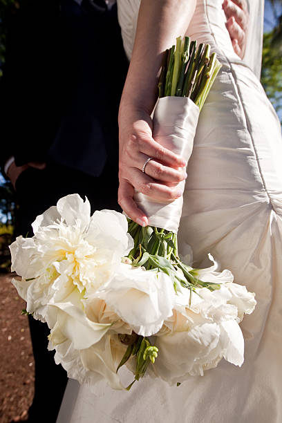 istock Beautiful Simple White Floral Bouquet Held by Bride 175260452