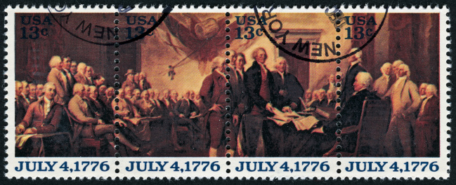 Cancelled Stamp From The United States Featuring The Signing Of The Declaration Of Independence.  The Artwork On The Stamp Was Made In 1817 By John Trumbull (Lived 1756-1843)