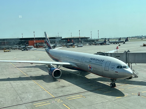 Kolkata, West Bengal, India - May 14 2019 : Passengers are boarding flight at Kolkata International airport, while ground crews checking their boarding passes and helping them to borad the plane.