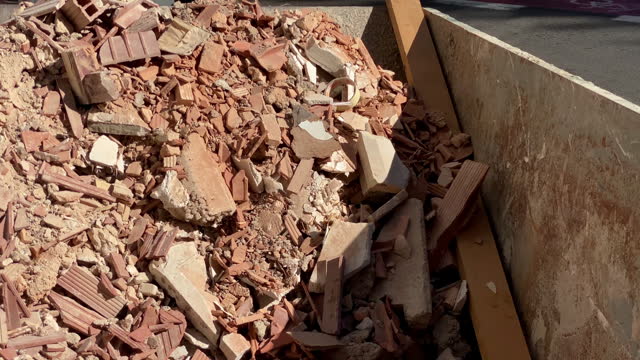 Rubble inside industrial garbage container
