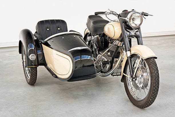 Motorcycle with sidecar "Old-fashioned motorcycle with sidecar - Junak M10 made in 1963, PolandSee more MOTORCYCLES images here:" sidecar stock pictures, royalty-free photos & images
