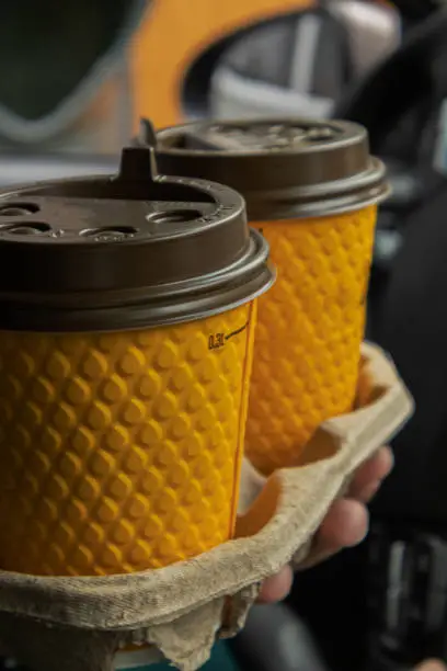 Photo of two coffees in a yellow glass