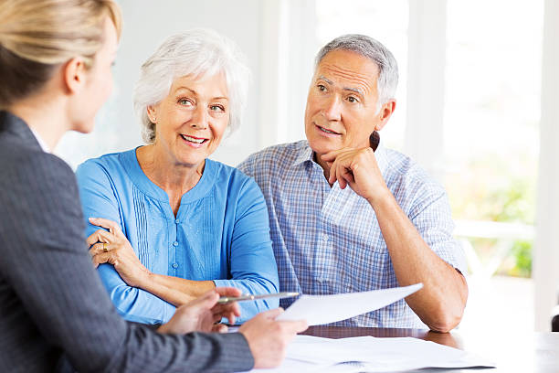 istock Senior Couple With Financial Advisor At Home. 175261186