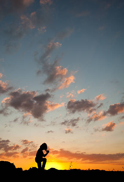 istock Silhouette of Young Boy Praying 175261524
