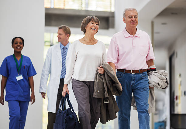 Senior Couple entering Hospital