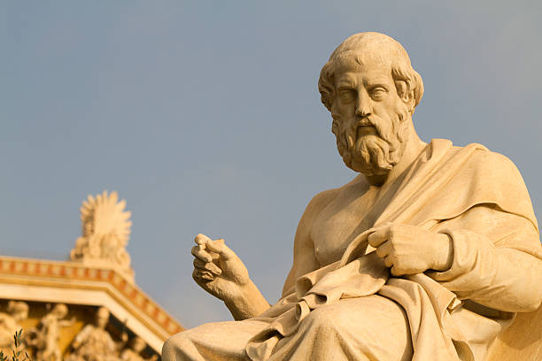 Statue of the Greek philosopher, Plato Statue of Plato, Greek Philosopher. Pediment of the building of the Academy of Athens in the background, Athens, Greece. philosopher stock pictures, royalty-free photos & images