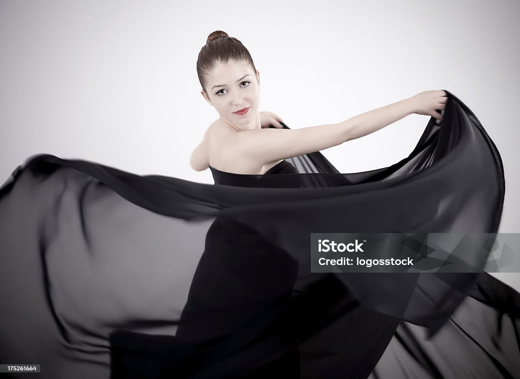 Dancing Beauty Dynamic image of a beautiful woman shot in studio Activity Stock Photo