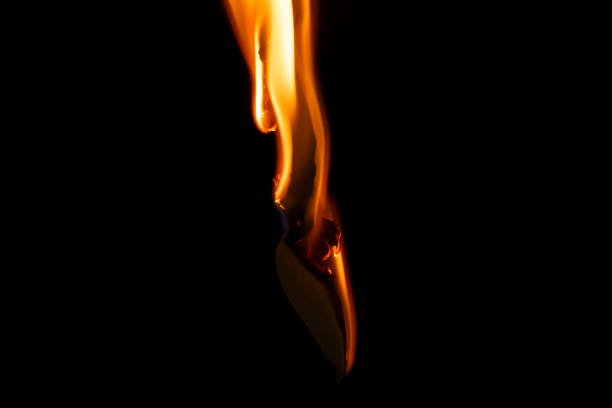 istock burning paper, glowing edge of paper on a black background 1752620946