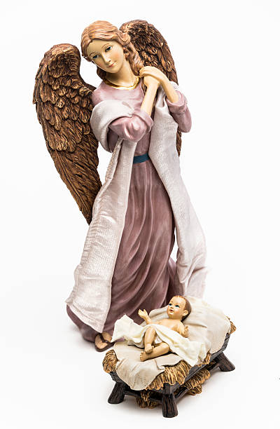 Nativity Scene Christmas greeting card. Bell-shaped angel with abstract Nativity Scene  inside, made with golden glitter on a red background