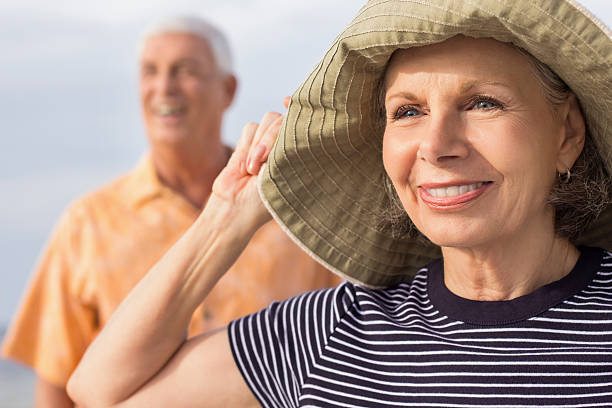istock Senior Couple Looking Away At Beach. 175262400