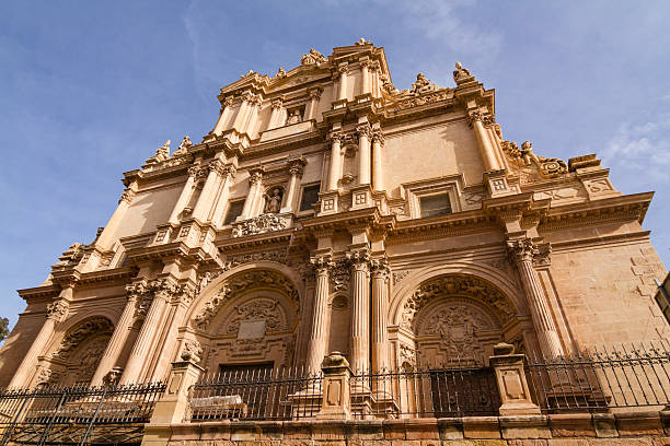 Baroque church in Spain looking up at the ornate carved frontage in Lorca lorca stock pictures, royalty-free photos & images