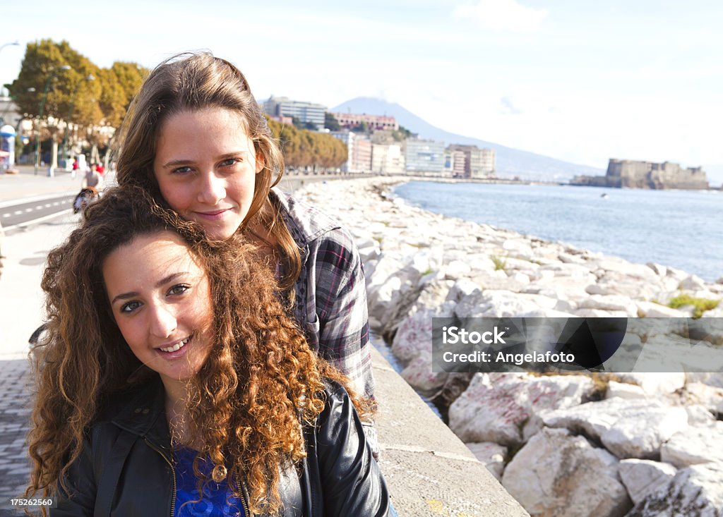 Two Beautiful Girls on Naples Promenade, Italy "Two Beautiful Girls on Naples Promenade, Italy, looking at camera." 14-15 Years Stock Photo
