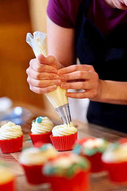 istock Female hands decorating delicious cupcakes 175262633