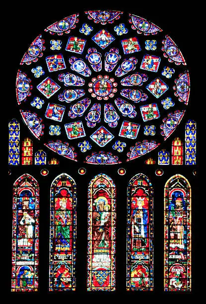 "This window is a gift of Queen Blanche of Castle in the 13th century. The North rose depicted the old testament figures prophesy or prefigure Christ, and Mary is the instrument whereby the prophecies were fulfilled. Beneath the rose the central figure in the st Anne, with the child Mary. In the other windows on either side of Anne, are two Old Testament figures, the large ones prefiguring Christ as priests and kings."