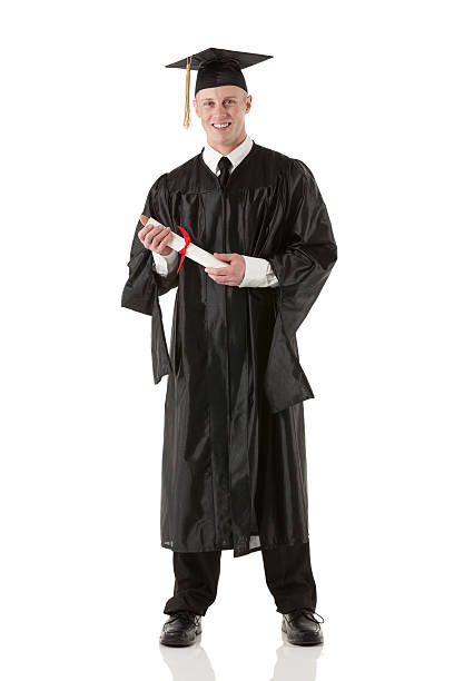 istock Young man in graduation gown and certificate 175262959